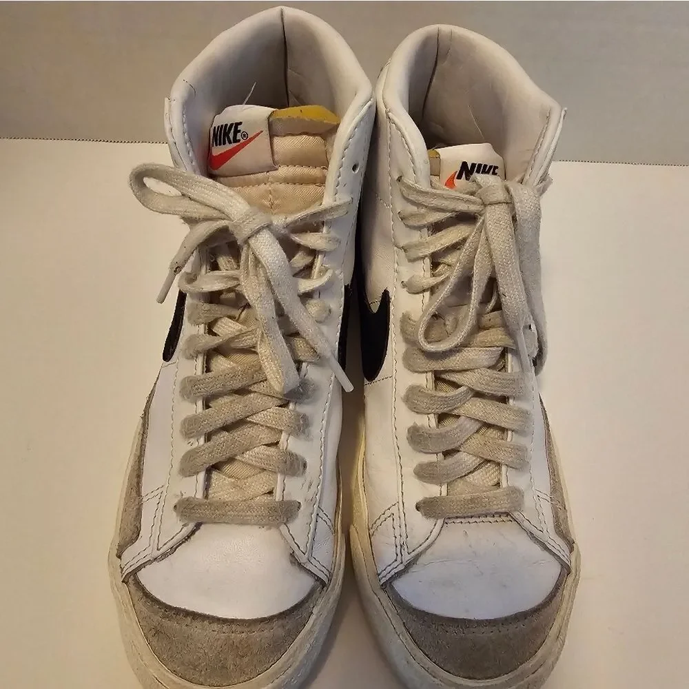 Nike leather hi top sneakers size 6. White with black swish